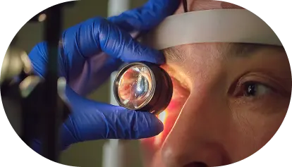 checking eyes with magnifier